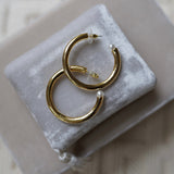 Nicola Bathie Jewelry Earrings Medium Chunky golden hoops + pearl