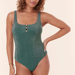  Andie Swim Lipari One Piece swimsuit in glitter Cascade, featuring a square neckline, maximum support, and adjustable straps. Model posing front-facing with a relaxed smile.