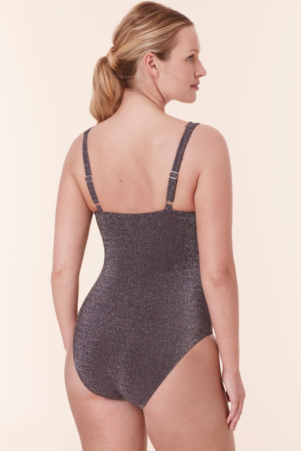 Back view of Andie Swim's Lipari One Piece in Glitter Cascade, featuring shimmering fabric and supportive straps