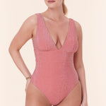 Elegant side view of The Mykonos One Piece by Andie Swim in Shell Glitter, designed for petite women with a sculpted fit and shimmering detail.