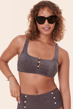 Front view of Andie Swim's Lipari Bikini Top in Licorice Glitter, highlighting removable soft cups, button accents, and a glittery design, perfect for a chic and confident swim style.