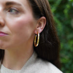 Nicola Bathie Jewelry Earrings Medium Chunky golden hoops + pearl