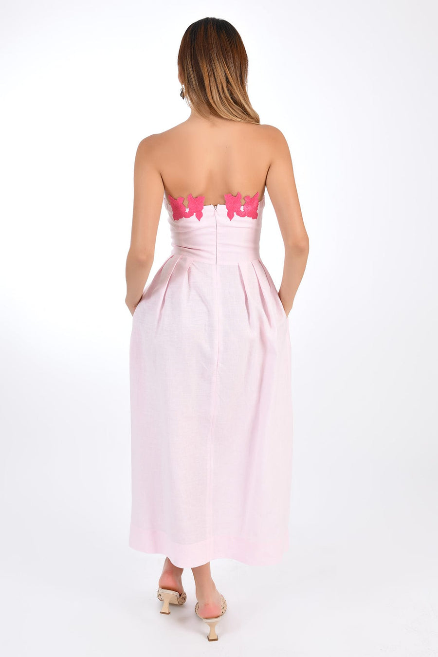 Fanm Mon Lorr Midi Dress in Light pink Linen, showcasing hand-embroidered floral appliques. Back View.